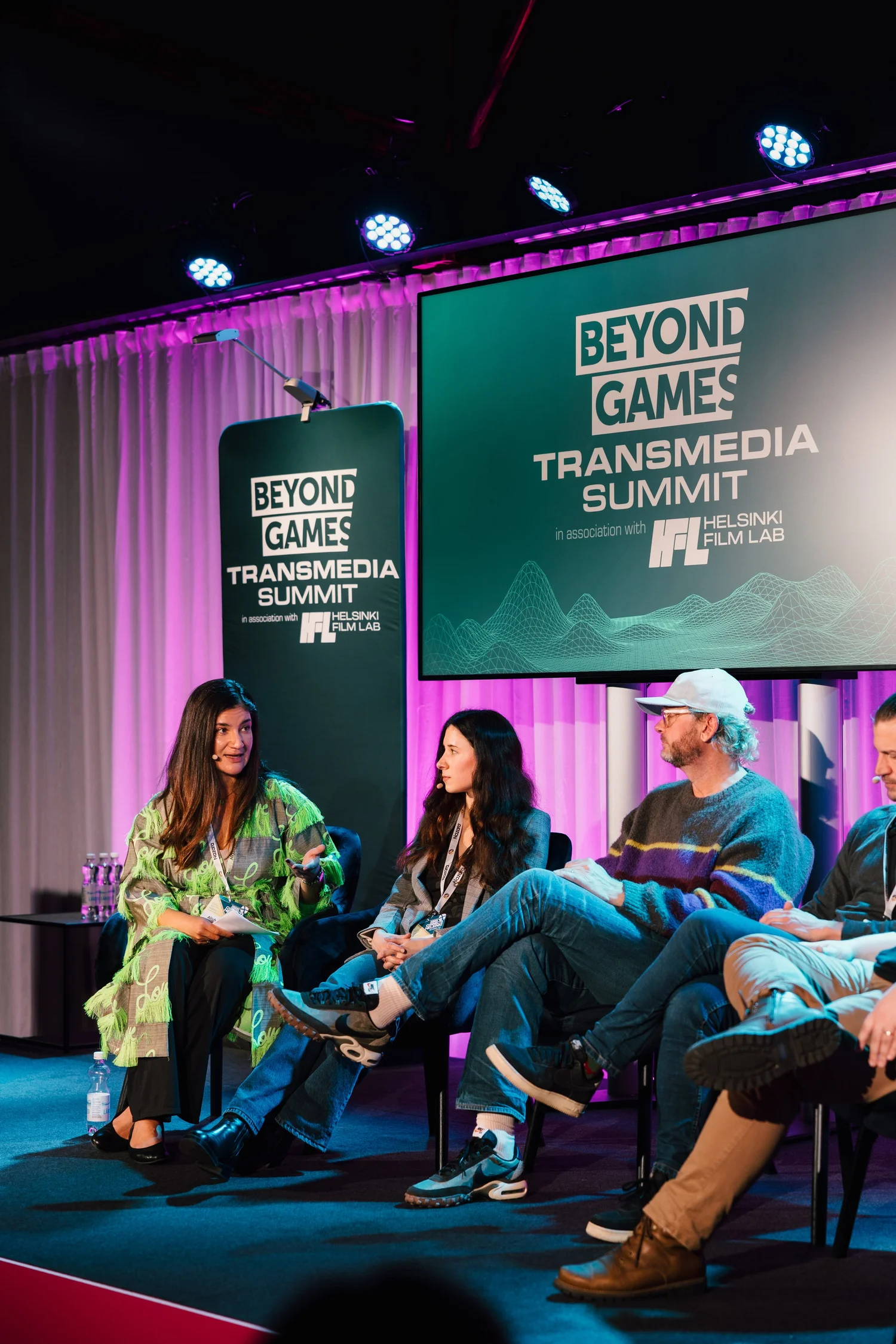 Speakers on stage at the 2025 Transmedia Summit